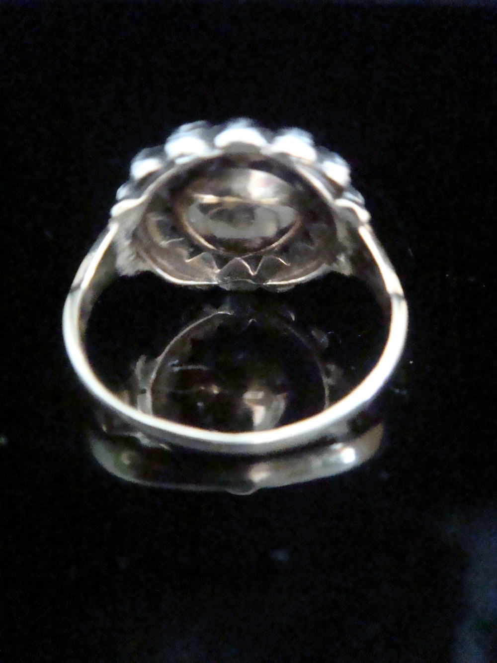 A Victorian 18ct yellow gold cluster ring featuring a central rose-cut diamond surrounded by a halo of smaller diamonds. View IV