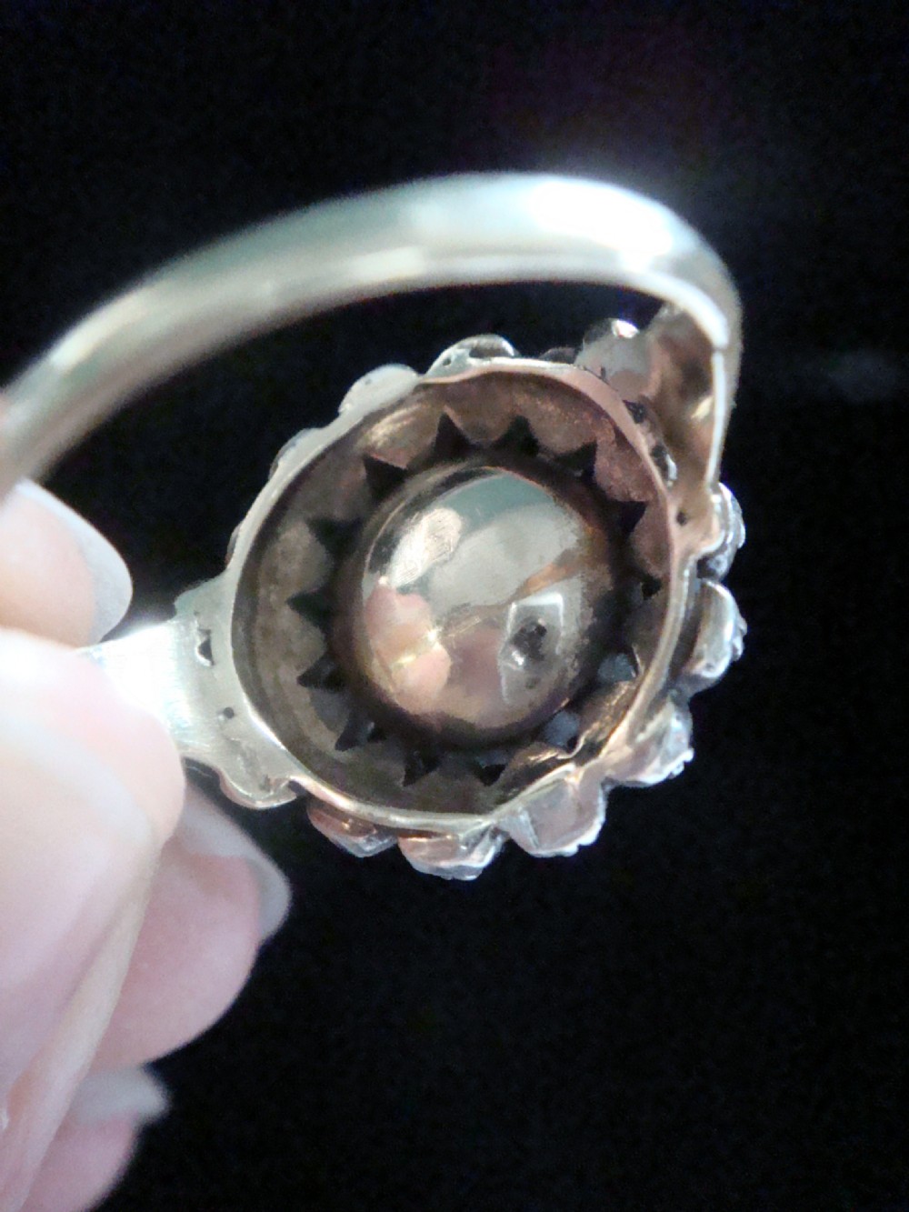 A Victorian 18ct yellow gold cluster ring featuring a central rose-cut diamond surrounded by a halo of smaller diamonds. View VIII