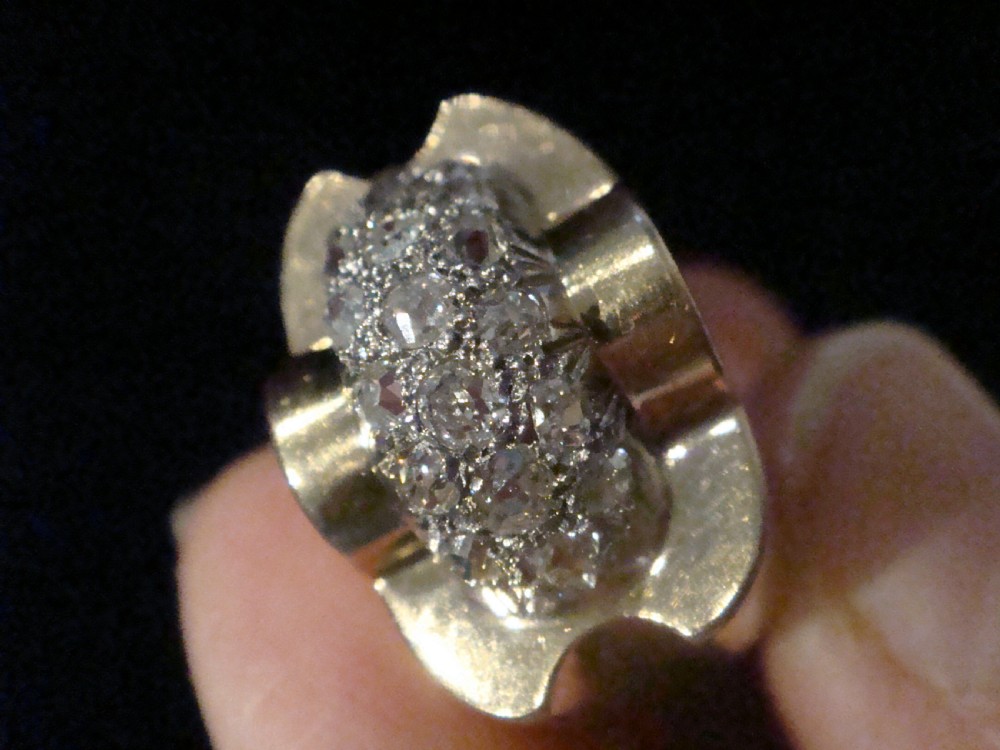 A French Retro Tank ring crafted in gold and platinum with a central pave-set diamond cluster. View III