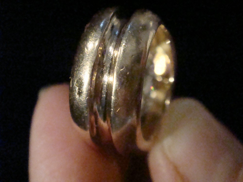 A French Retro Tank ring crafted in gold and platinum with a central pave-set diamond cluster. View V