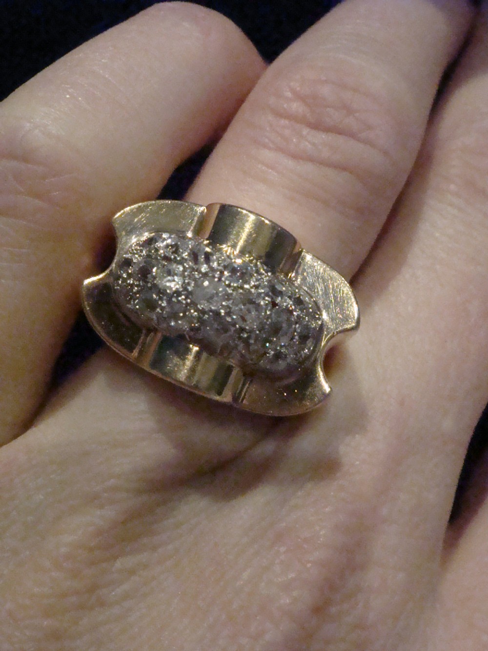 A French Retro Tank ring crafted in gold and platinum with a central pave-set diamond cluster. View VIII