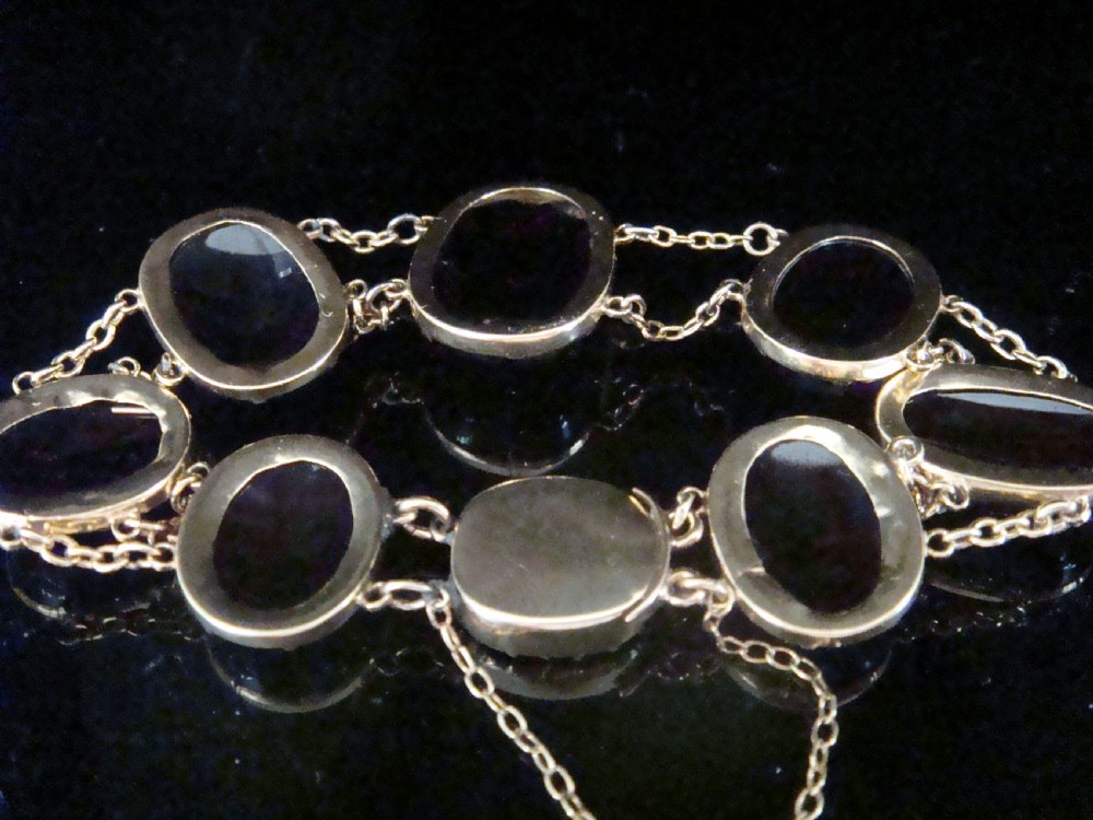 Edwardian 9ct large cabochon garnet bracelet with concealed garnet clasp View VI