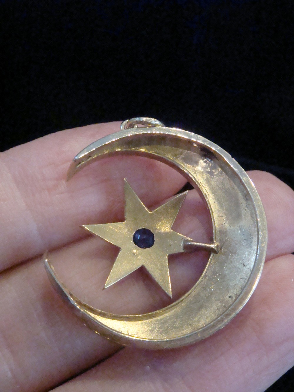 Victorian 15ct yellow gold crescent moon pendant set with split seed pearls, enclosing a central six-pointed star with a blue sapphire. View III