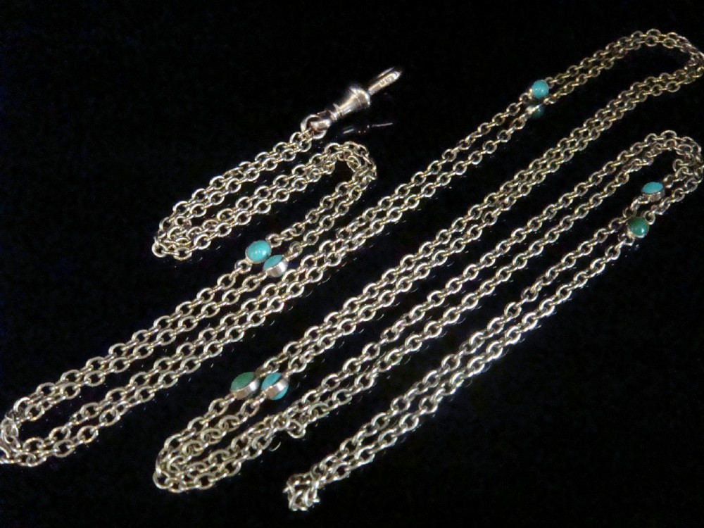 An Edwardian 9ct yellow gold link longuard chain interspersed with round turquoise cabochons. View III