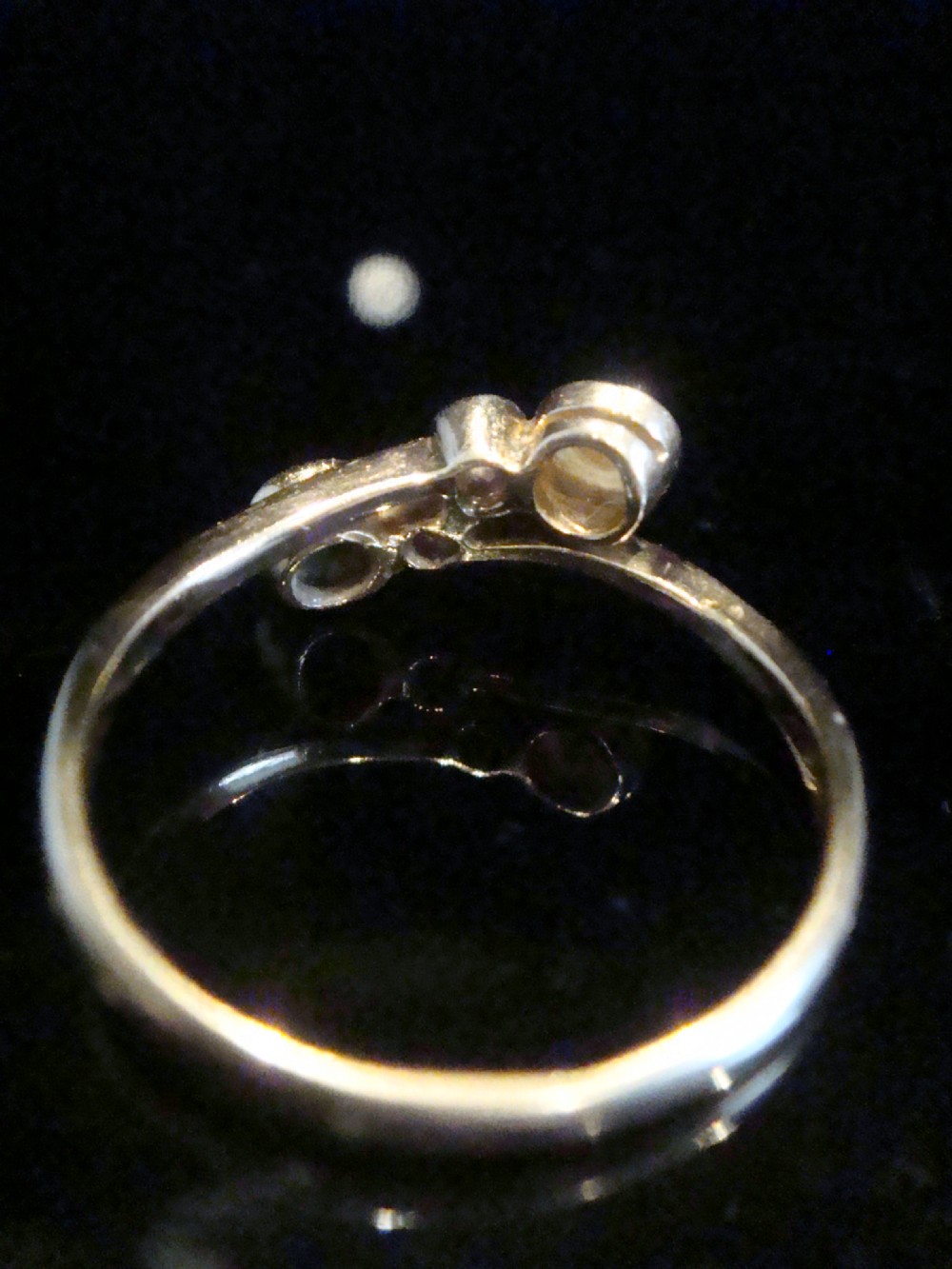 An Edwardian 18ct yellow gold crossover ring set with a turquoise cabochon, a pearl, and two accent diamonds. View II