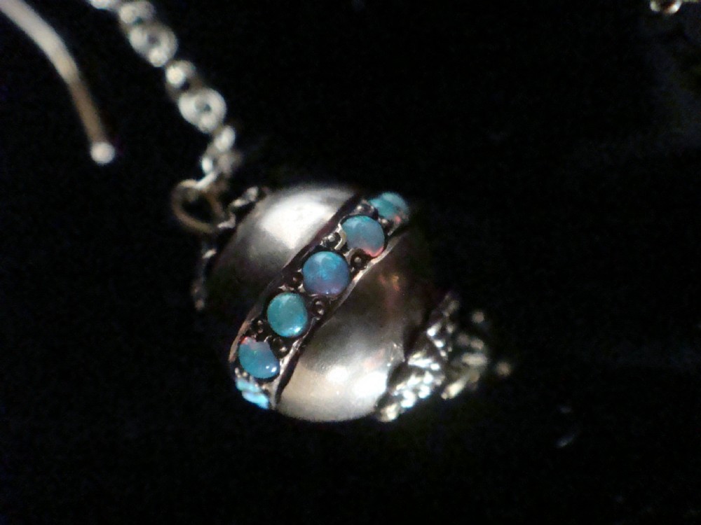 Pair of Edwardian 15ct yellow gold drop earrings with spherical pendants decorated with a central band of round natural opals. View II