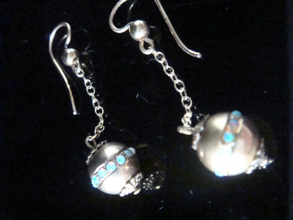 Pair of Edwardian 15ct yellow gold drop earrings with spherical pendants decorated with a central band of round natural opals. View IV