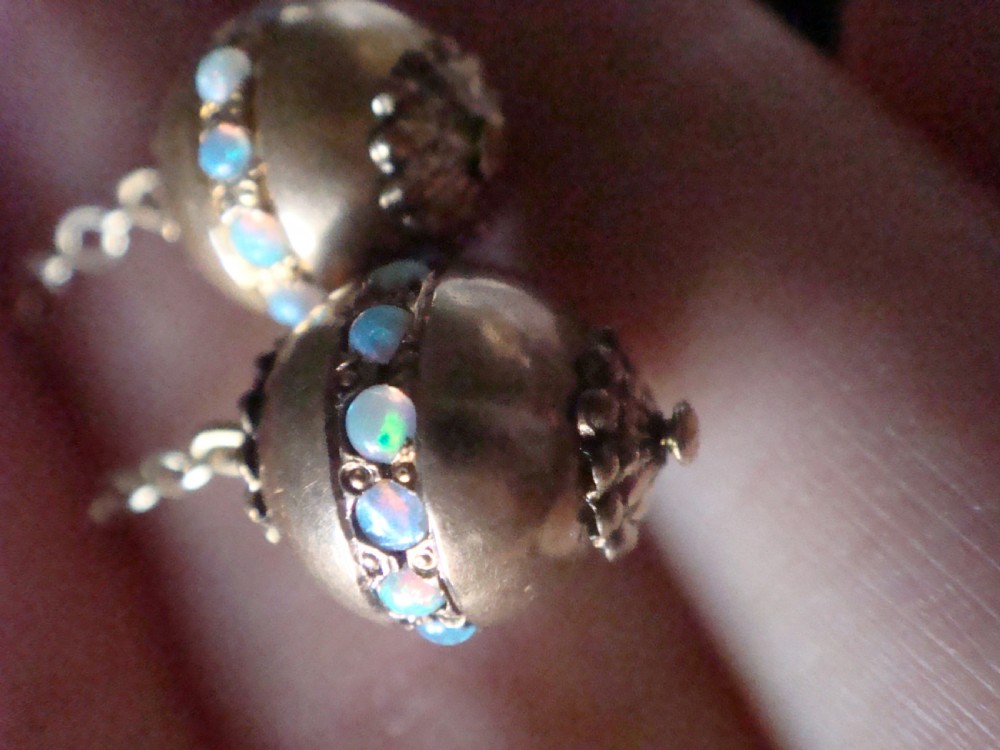Pair of Edwardian 15ct yellow gold drop earrings with spherical pendants decorated with a central band of round natural opals. View VI
