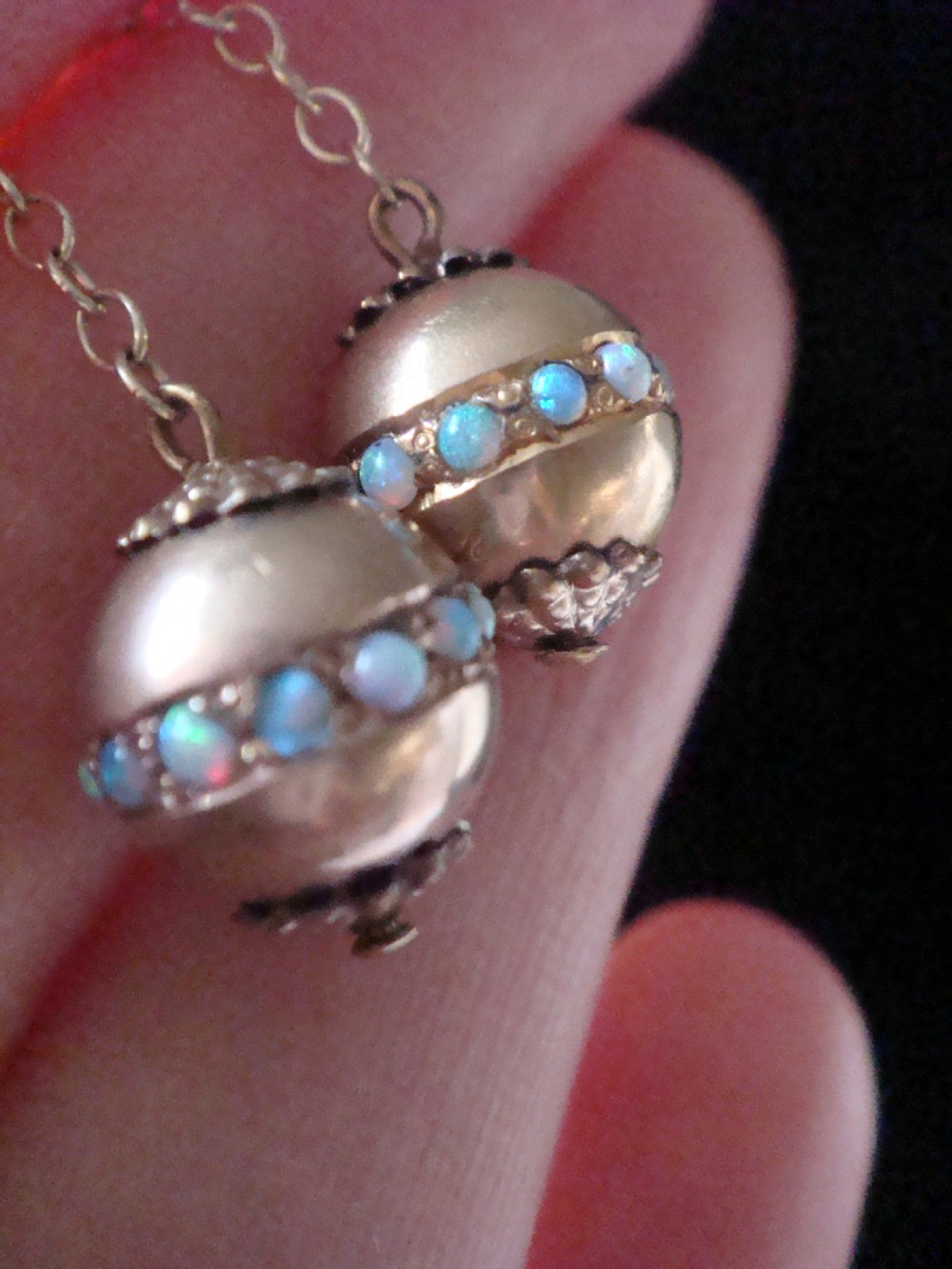 Pair of Edwardian 15ct yellow gold drop earrings with spherical pendants decorated with a central band of round natural opals. View VIII