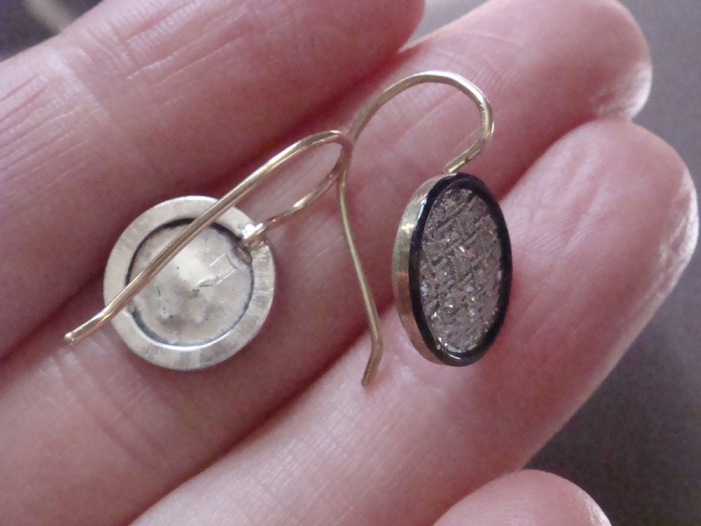 Pair of circular Edwardian drop earrings featuring pave-set diamonds surrounded by a black enamel border with wire fittings. View II