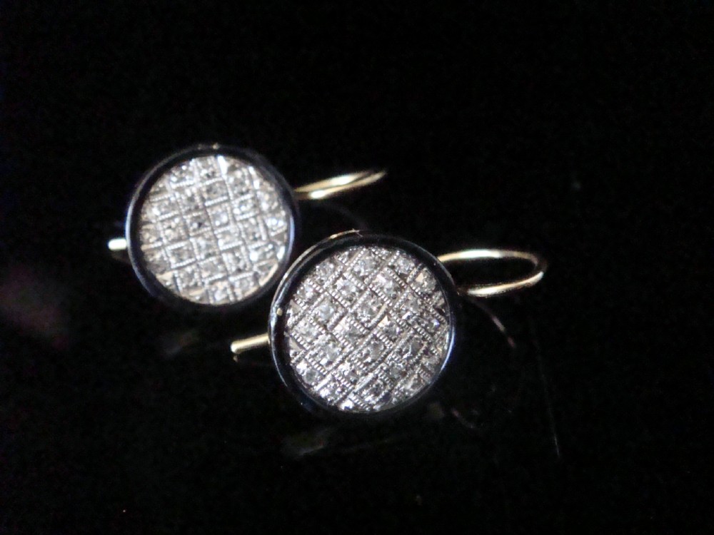 Pair of circular Edwardian drop earrings featuring pave-set diamonds surrounded by a black enamel border with wire fittings. View III