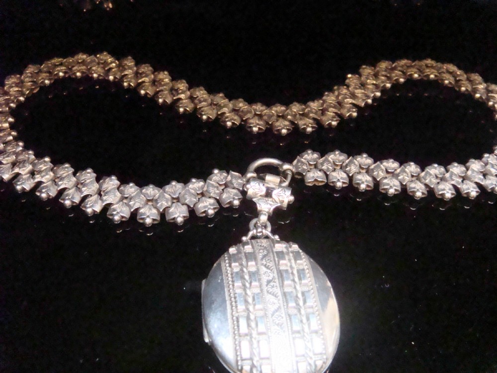Early Victorian silver book chain and locket