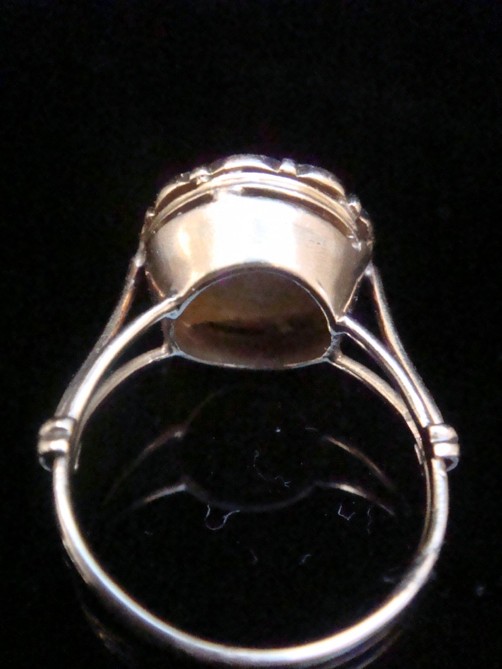 An Edwardian 18ct yellow gold and platinum ring featuring a floral starburst cluster set with old-cut diamonds. View III