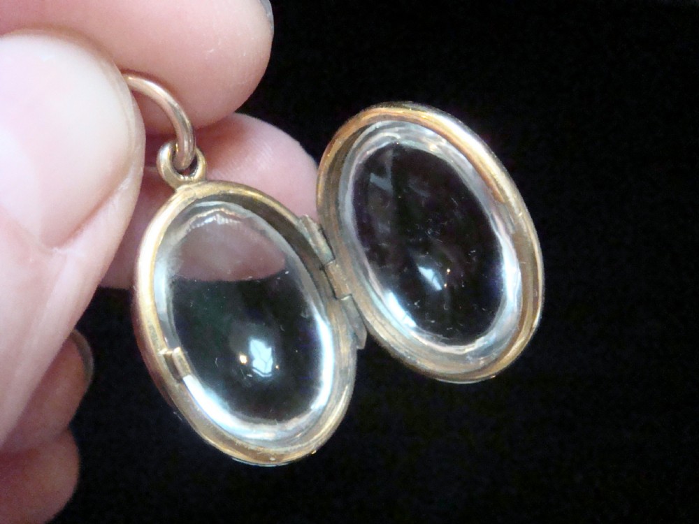 Edwardian 9ct rolled gold heavy thick rounded pools of light crystal locket View V