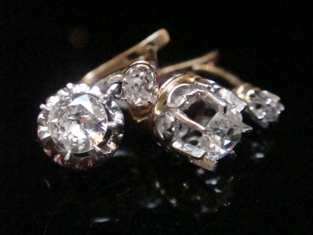 A pair of Edwardian 18ct yellow gold drop earrings featuring old cut diamonds set in coronet claw mountings. View II
