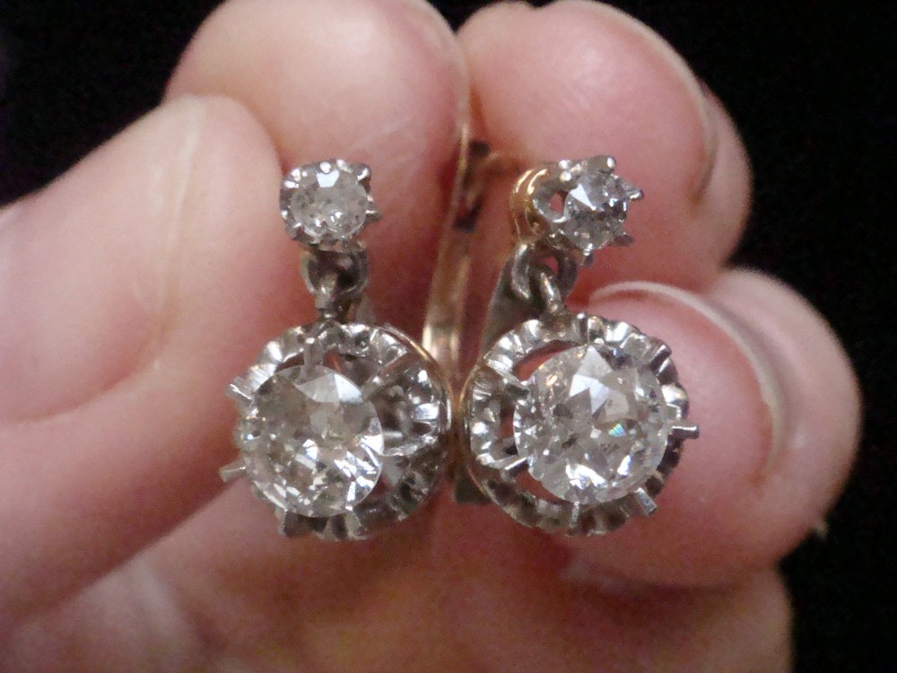 A pair of Edwardian 18ct yellow gold drop earrings featuring old cut diamonds set in coronet claw mountings. View III