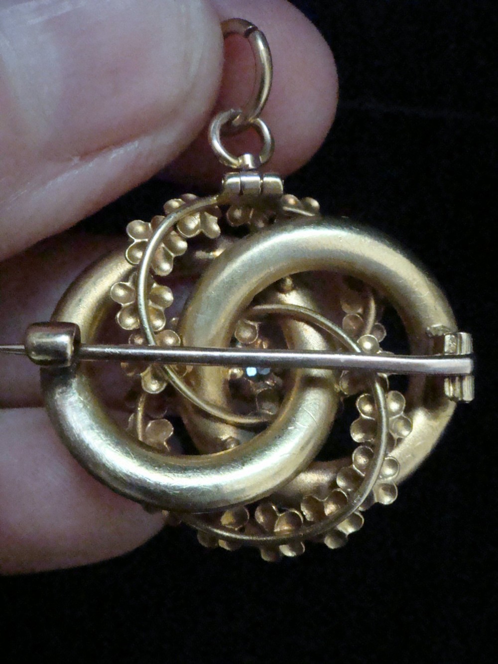 Victorian 18ct textured gold lovers knot brooch and pendant featuring light blue enamelled forget-me-not flowers and a central solitaire diamond. View III