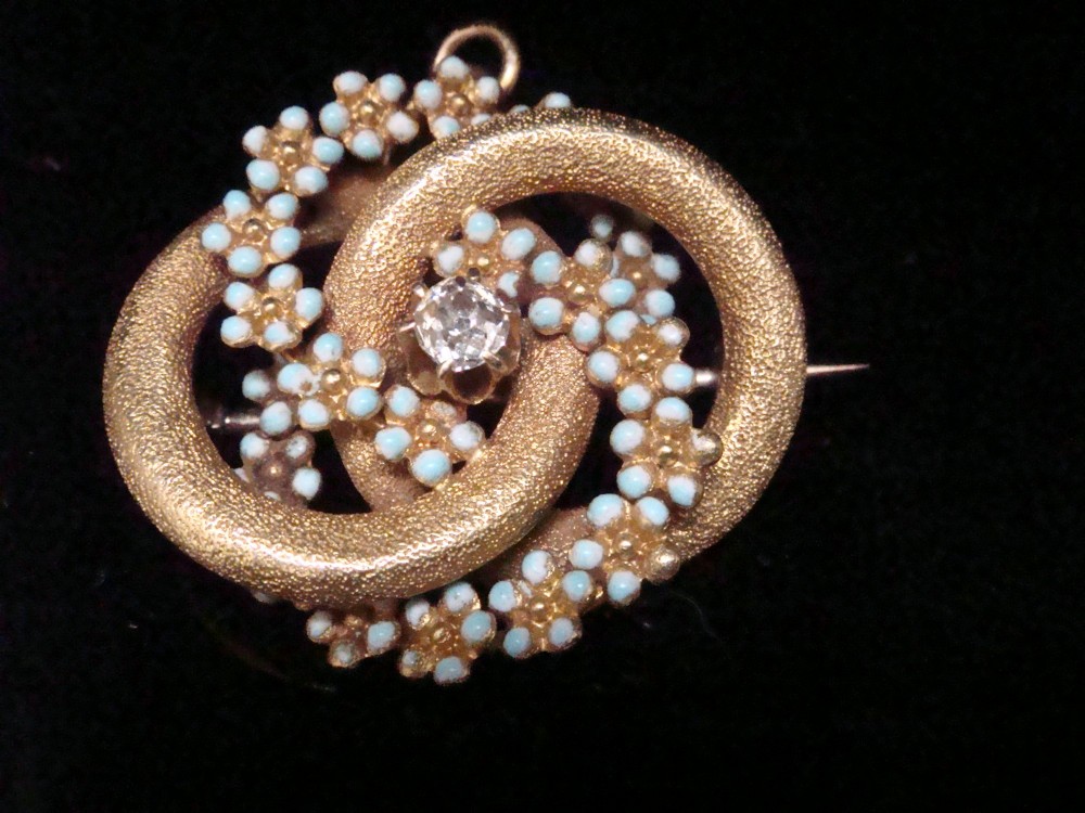 Victorian 18ct textured gold lovers knot brooch and pendant featuring light blue enamelled forget-me-not flowers and a central solitaire diamond. View VII