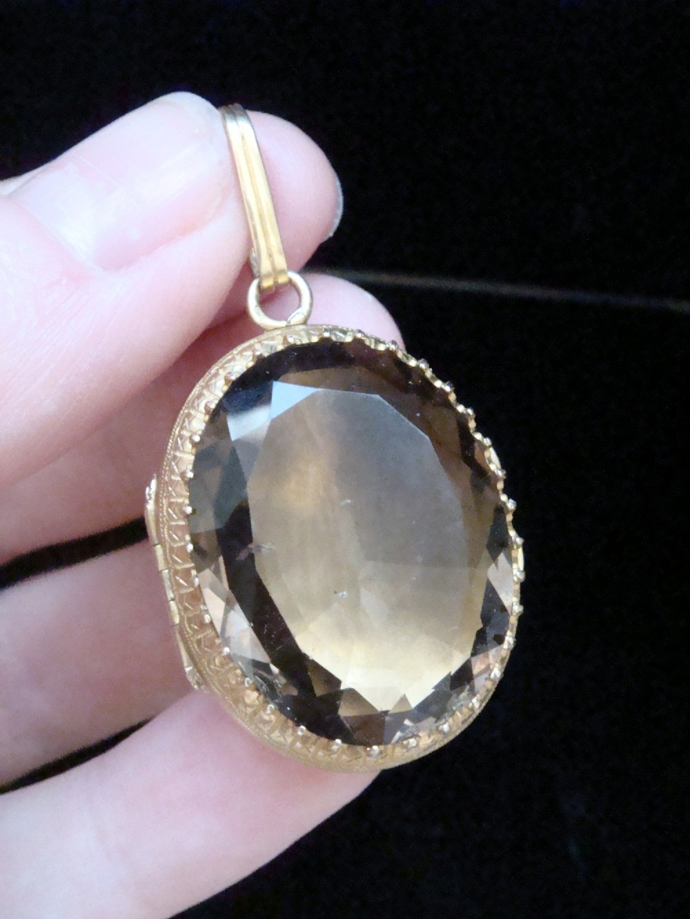Victorian 18ct yellow gold locket pendant set with a large faceted oval brown citrine gemstone.