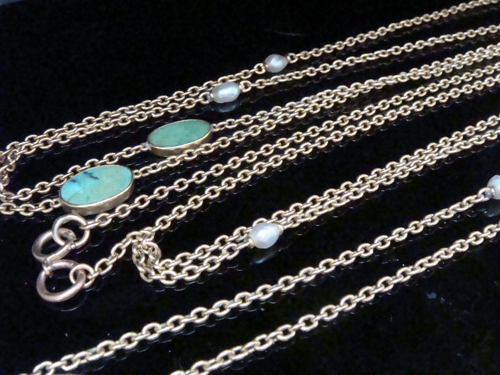 An Edwardian 15ct yellow gold longuard chain featuring oval turquoise cabochons set in collet mounts interspersed with natural pearls. View VIII