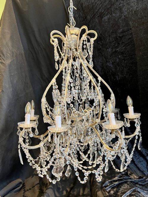 A PAIR OF EIGHT LIGHT FLORENTINE ANTIQUE CHANDELIERS - ADDITIONAL PHOTO 1
