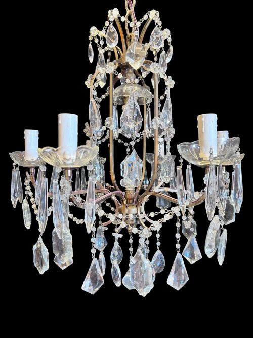 fig 1. An antique six-light French brass cage chandelier embellished with cut crystal drops and glass bobeches.