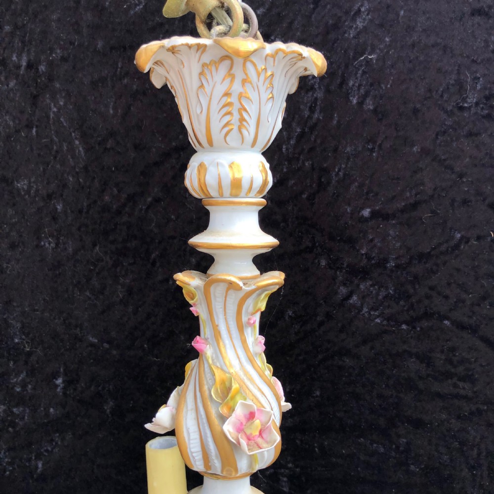 A three-arm Capodimonte porcelain chandelier with white glaze, gold scroll detailing, applied ceramic flowers, and candle-style bulb holders. View II
