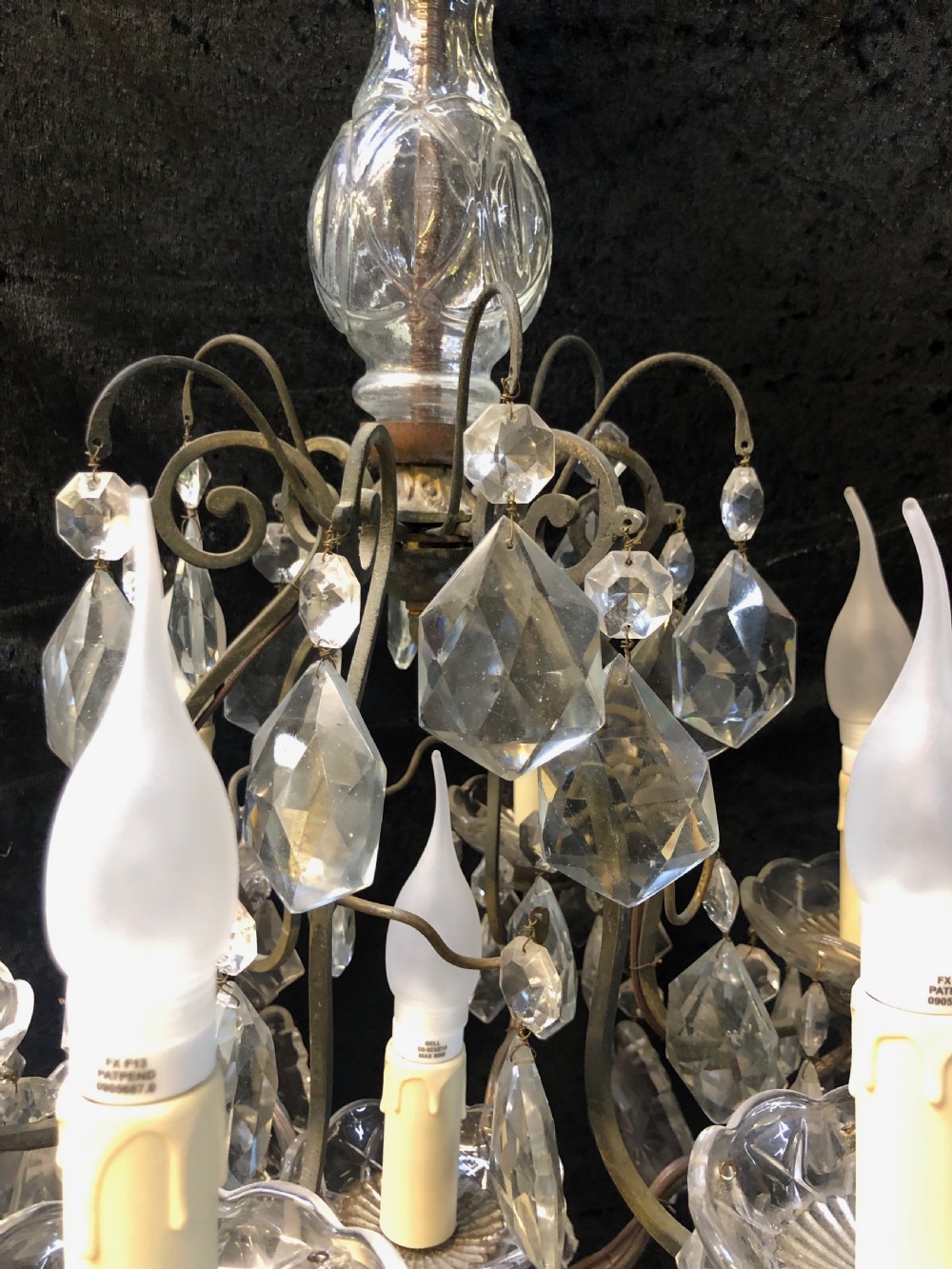 A nine-light French cage-style chandelier featuring a dark patinated metal frame decorated with cut glass crystal drops and a central blown glass stem. View III