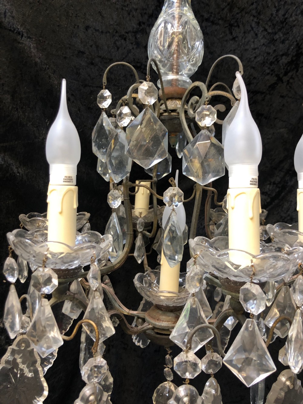 A nine-light French cage-style chandelier featuring a dark patinated metal frame decorated with cut glass crystal drops and a central blown glass stem. View IV