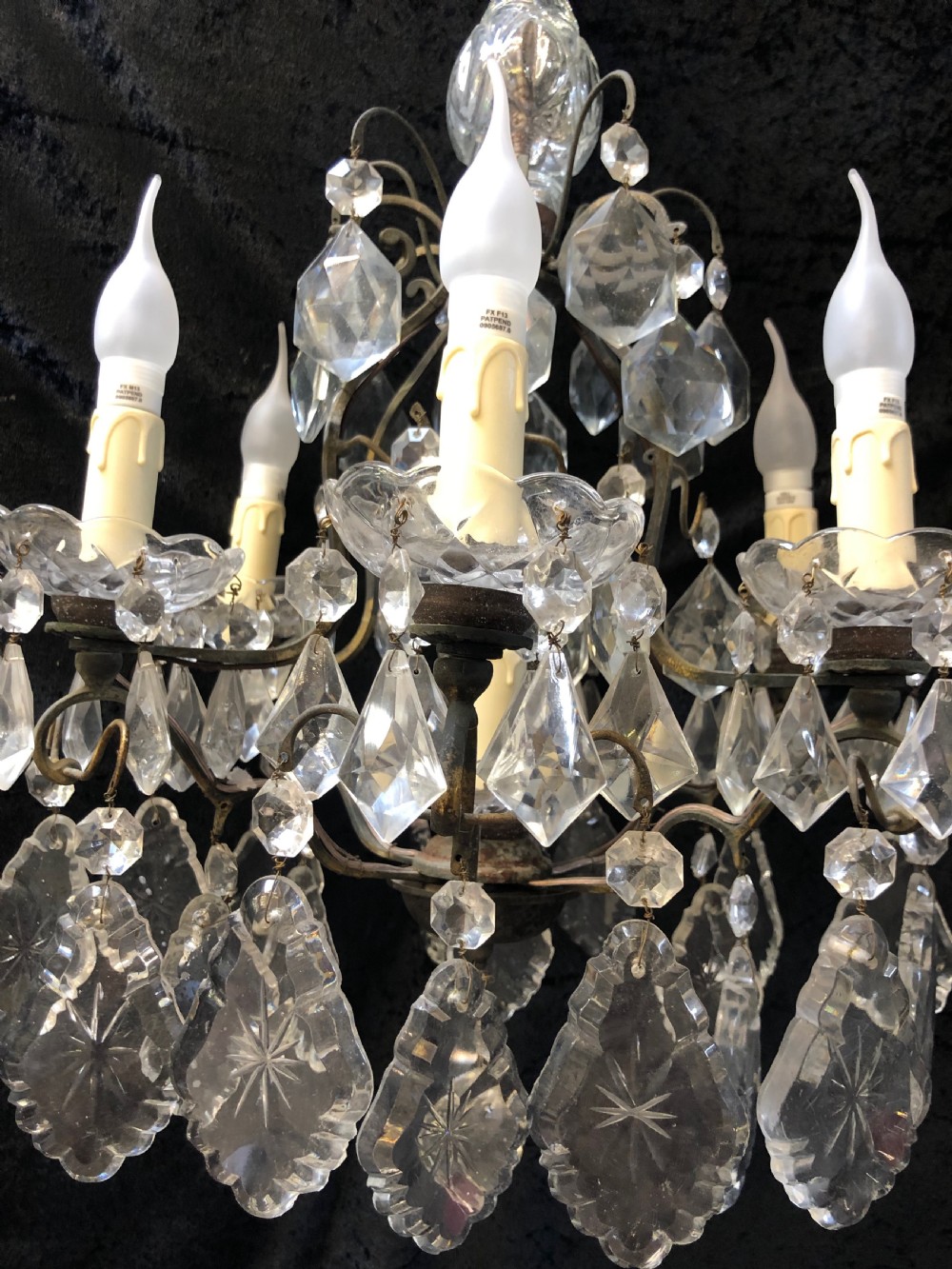 A nine-light French cage-style chandelier featuring a dark patinated metal frame decorated with cut glass crystal drops and a central blown glass stem. View V