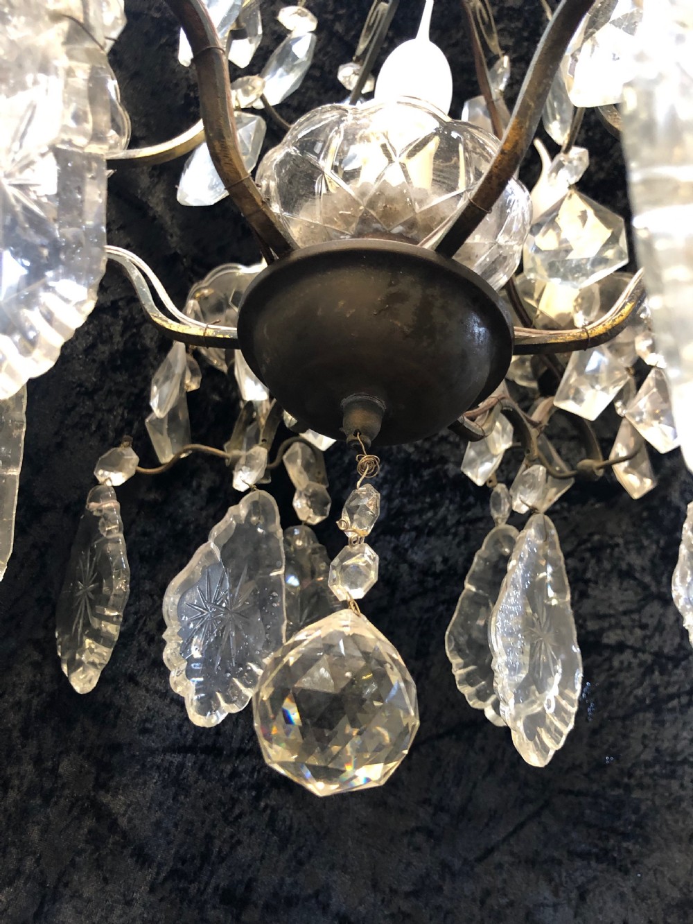 A nine-light French cage-style chandelier featuring a dark patinated metal frame decorated with cut glass crystal drops and a central blown glass stem. View VII