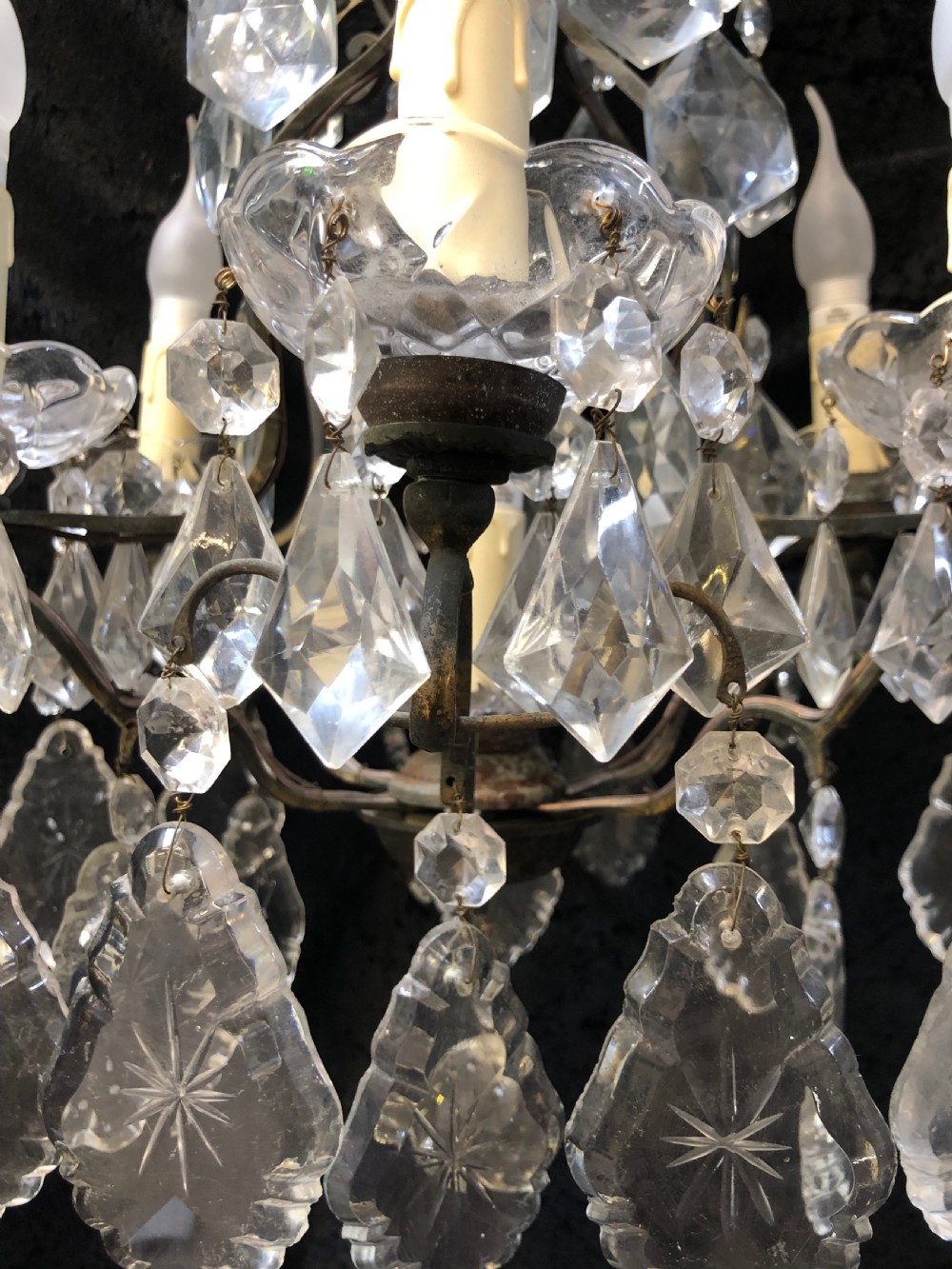 A nine-light French cage-style chandelier featuring a dark patinated metal frame decorated with cut glass crystal drops and a central blown glass stem. View VIII