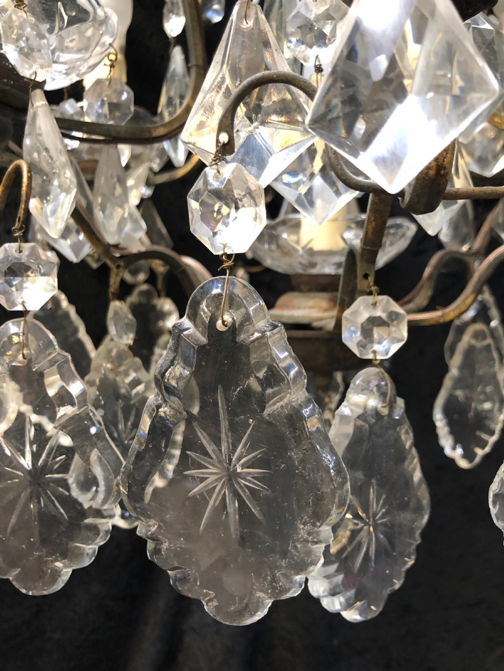 A nine-light French cage-style chandelier featuring a dark patinated metal frame decorated with cut glass crystal drops and a central blown glass stem. View IX
