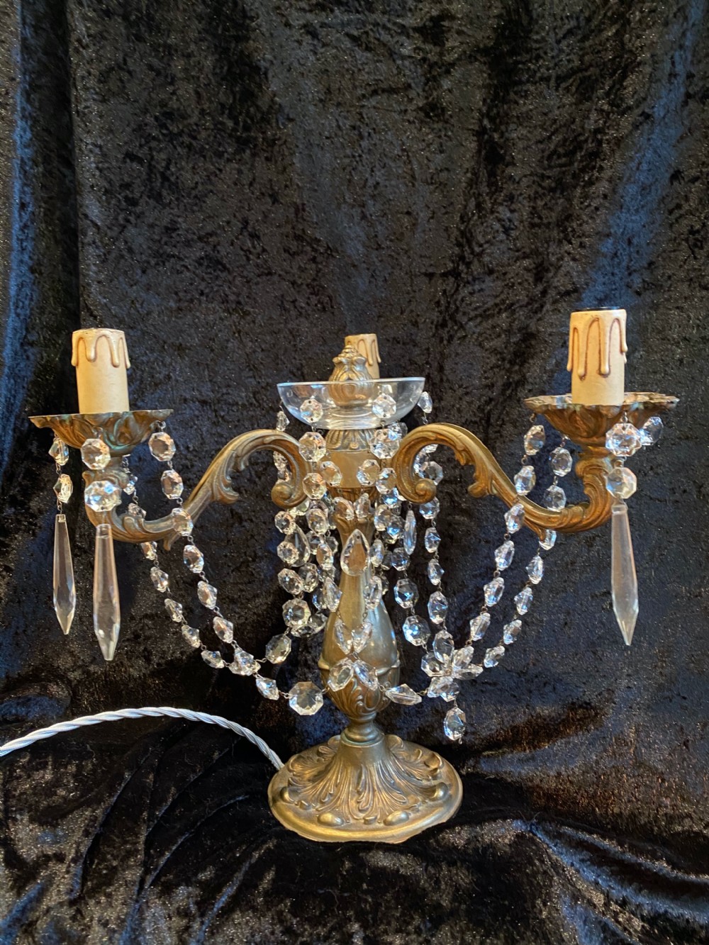 A pair of French gilt brass three-light candelabra table lamps adorned with hanging clear crystal prisms and beads. View III