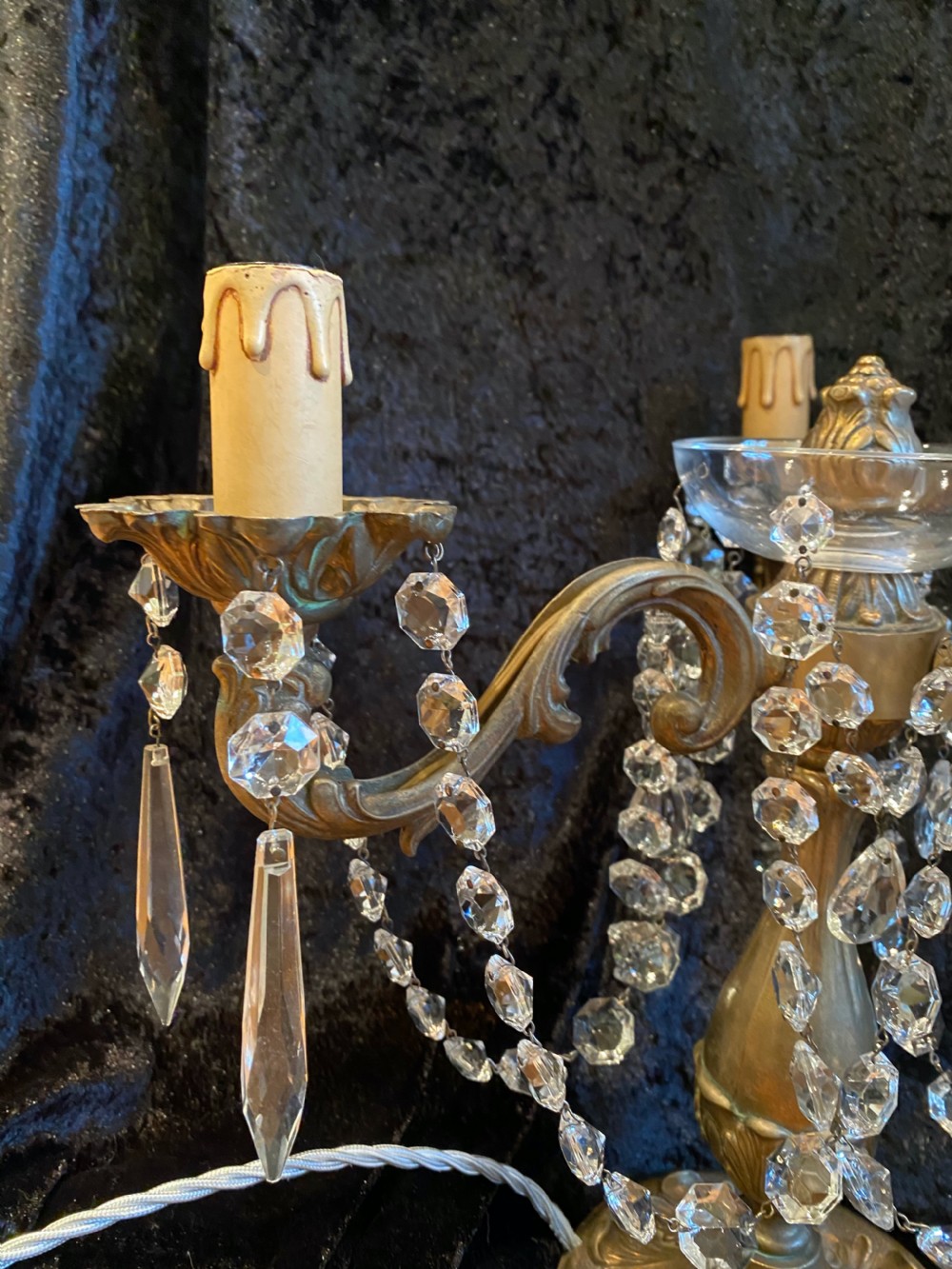 A pair of French gilt brass three-light candelabra table lamps adorned with hanging clear crystal prisms and beads. View VII