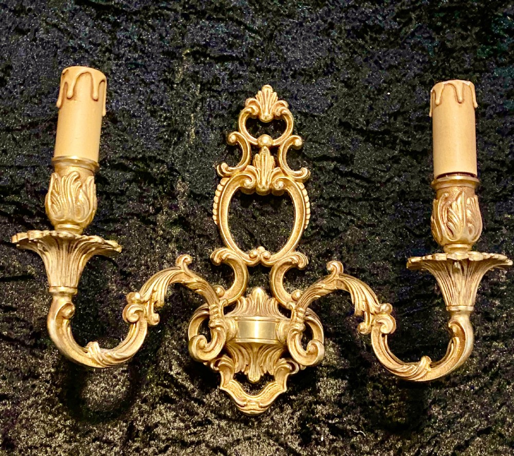 A PAIR OF TWO ARM FRENCH BRASS WALL-LIGHTS WITH OPEN FRAME View II