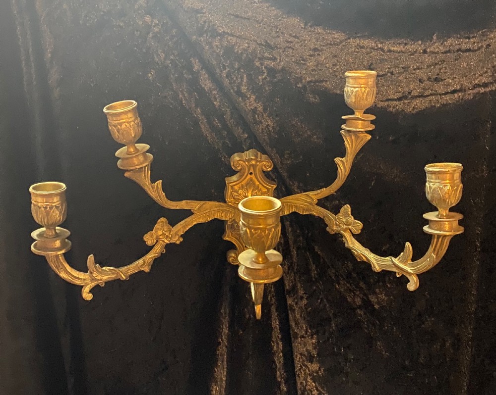 A PAIR OF FIVE ARM BRASS FRENCH WALL-LIGHTS