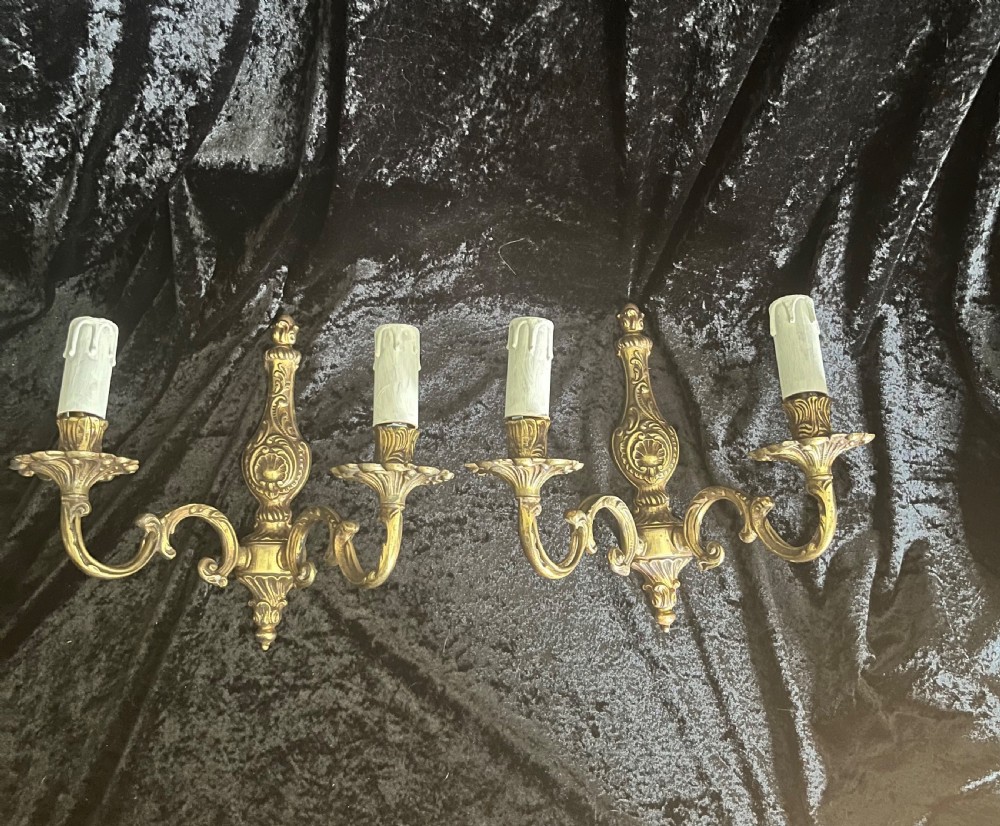 A Pair Of Twin Light Antique French Brass Wall Lights.