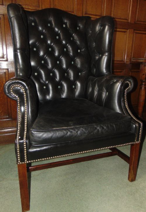 GEORGIAN MAHOGANY WING CHAIR IN LEATHER CIRCA 1820