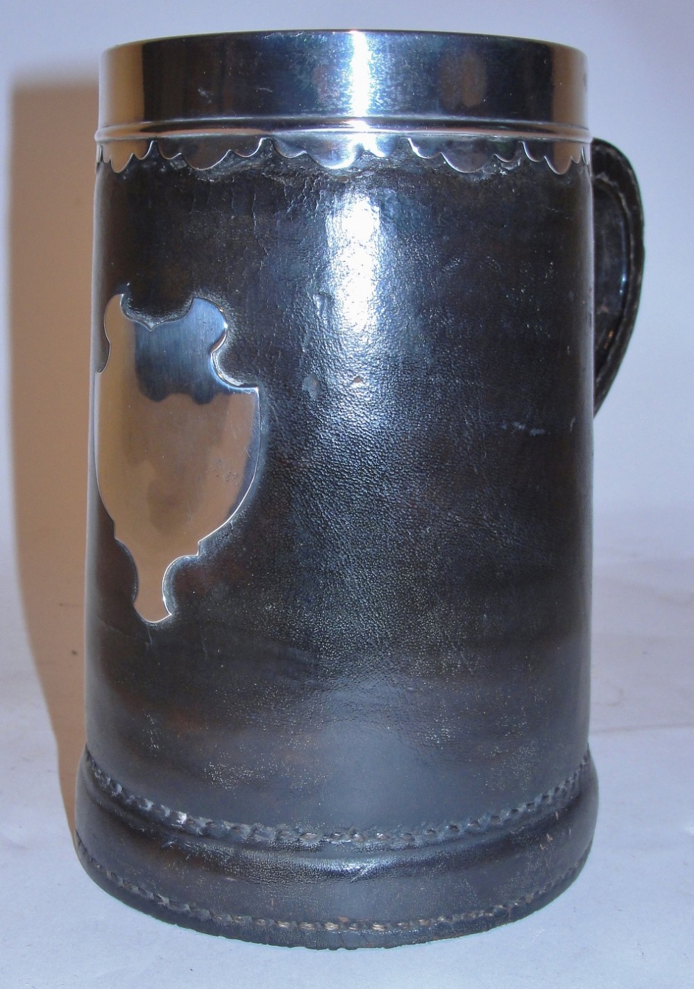 Antique silver mounted leather tankard. Circa 1875