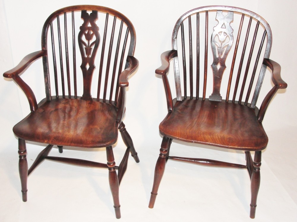 Pair Georgian fruitwood windsor elbow chairs. Circa 1800
