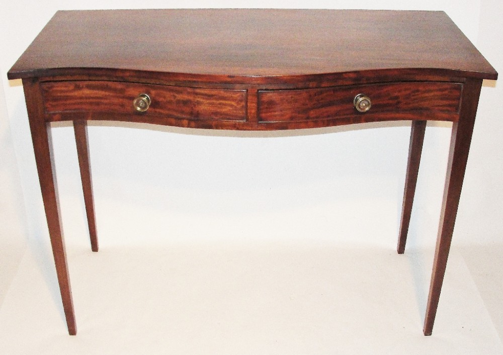 Georgian serpentine side table. Circa 1810