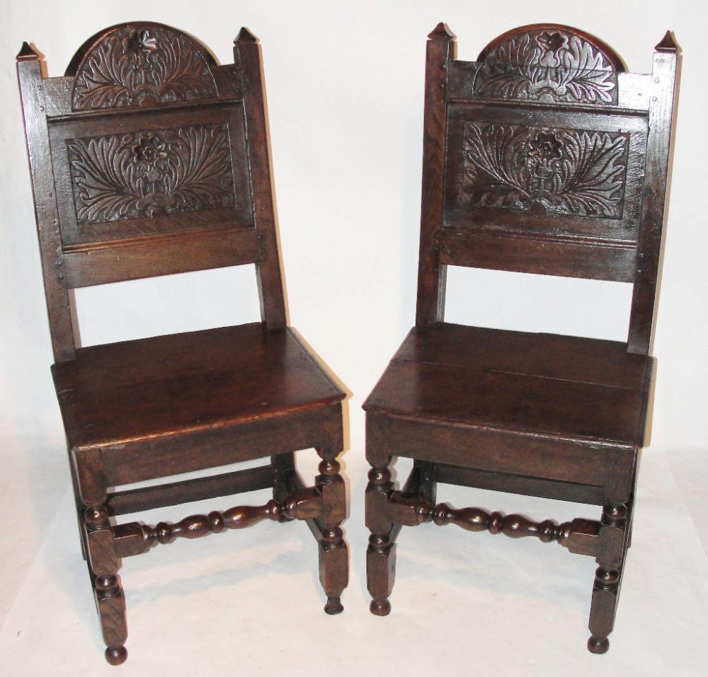 Pair Stuart carved oak chairs. Circa 1670