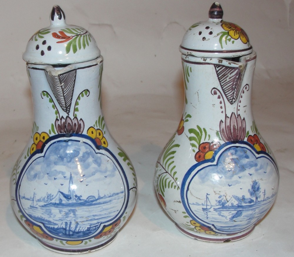 Pair 18th. century dutch delft lidded jugs. Circa 1710