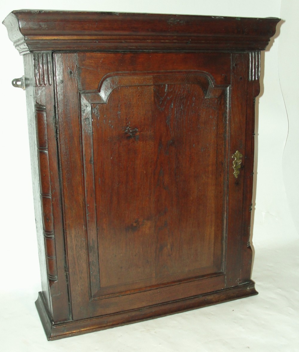 Georgian oak hanging spice cabinet. Circa 1770
