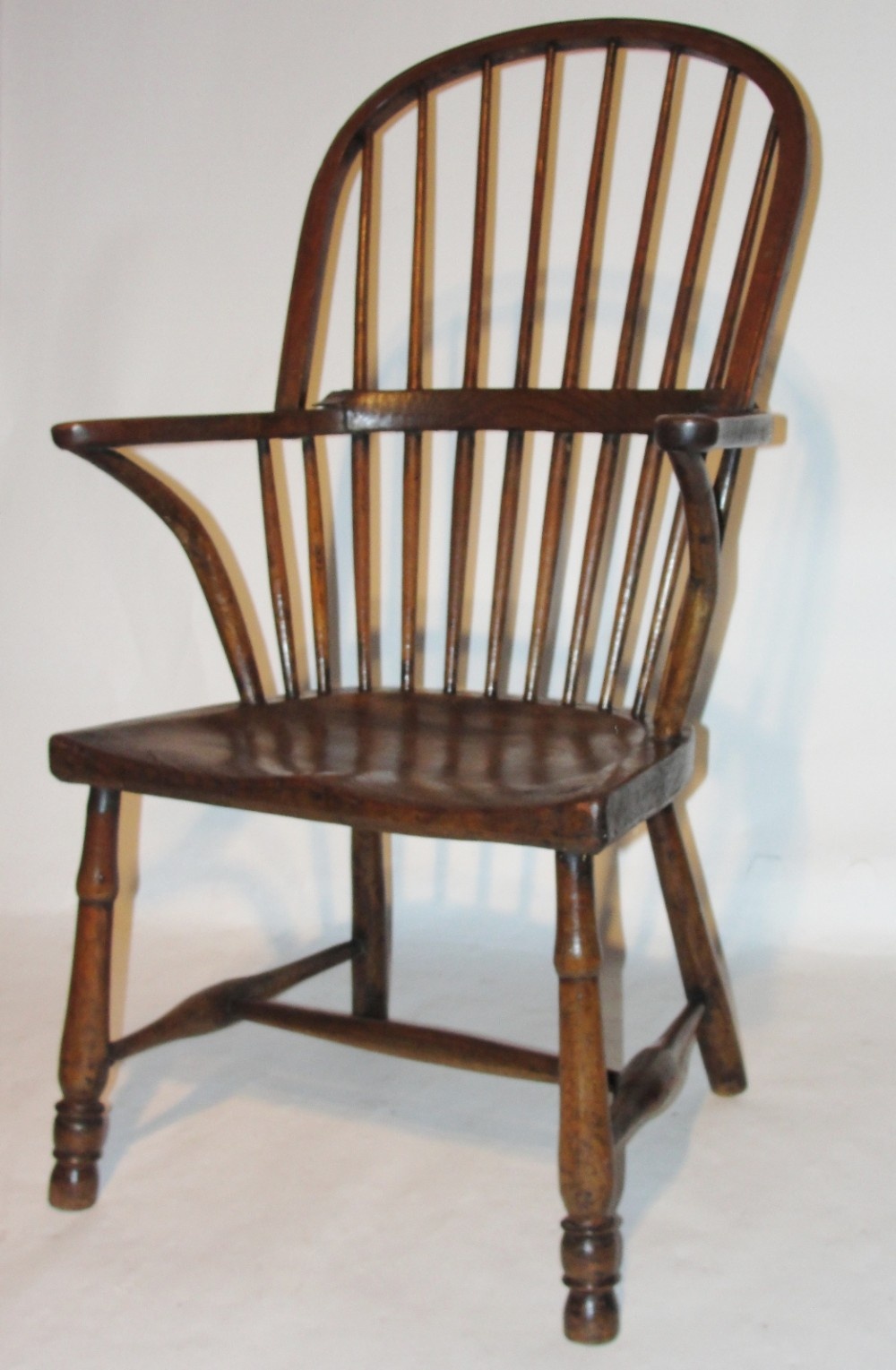 Georgian elm and fruitwood comb back windsor elbow chair Circa 1770