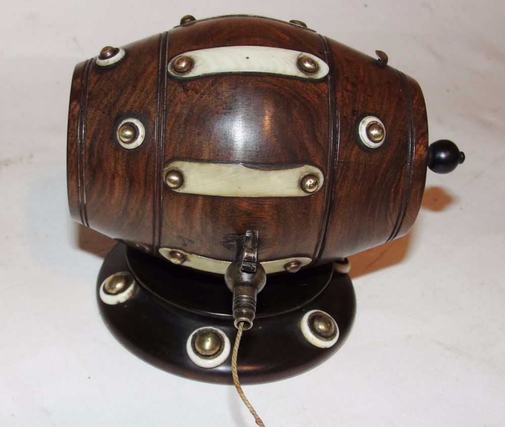 Victorian lignum barrel shaped string box. Circa 1870
