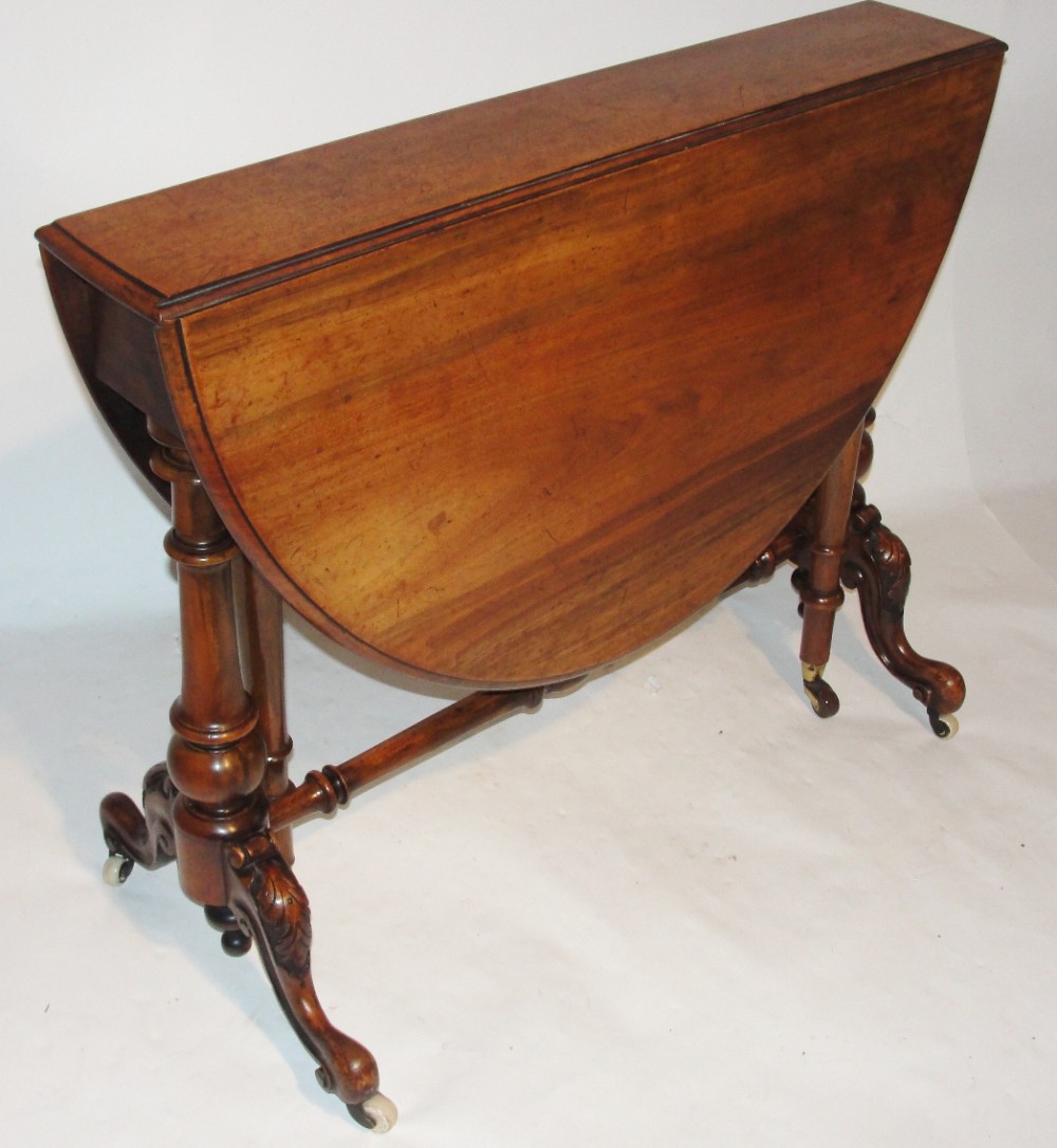 Victorian walnut sutherland table. Circa 1860