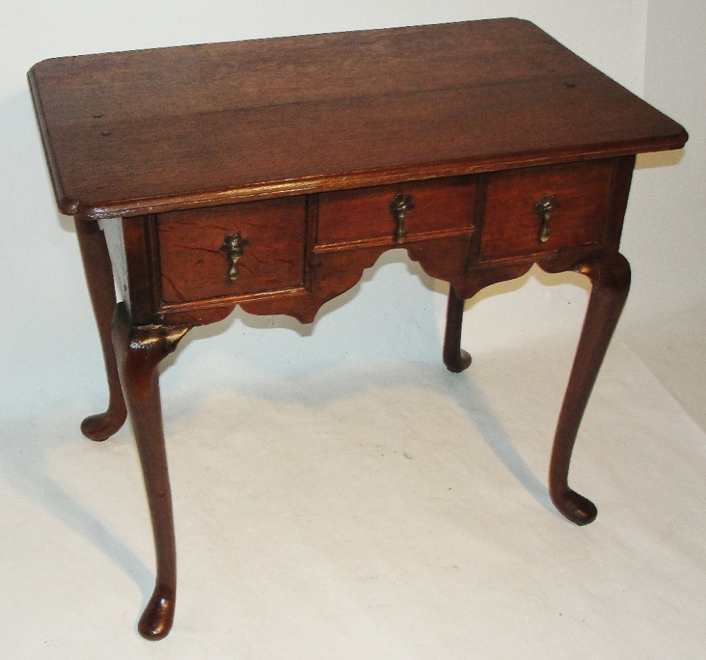 Georgian oak cabriole leg lowboy. Circa 1750