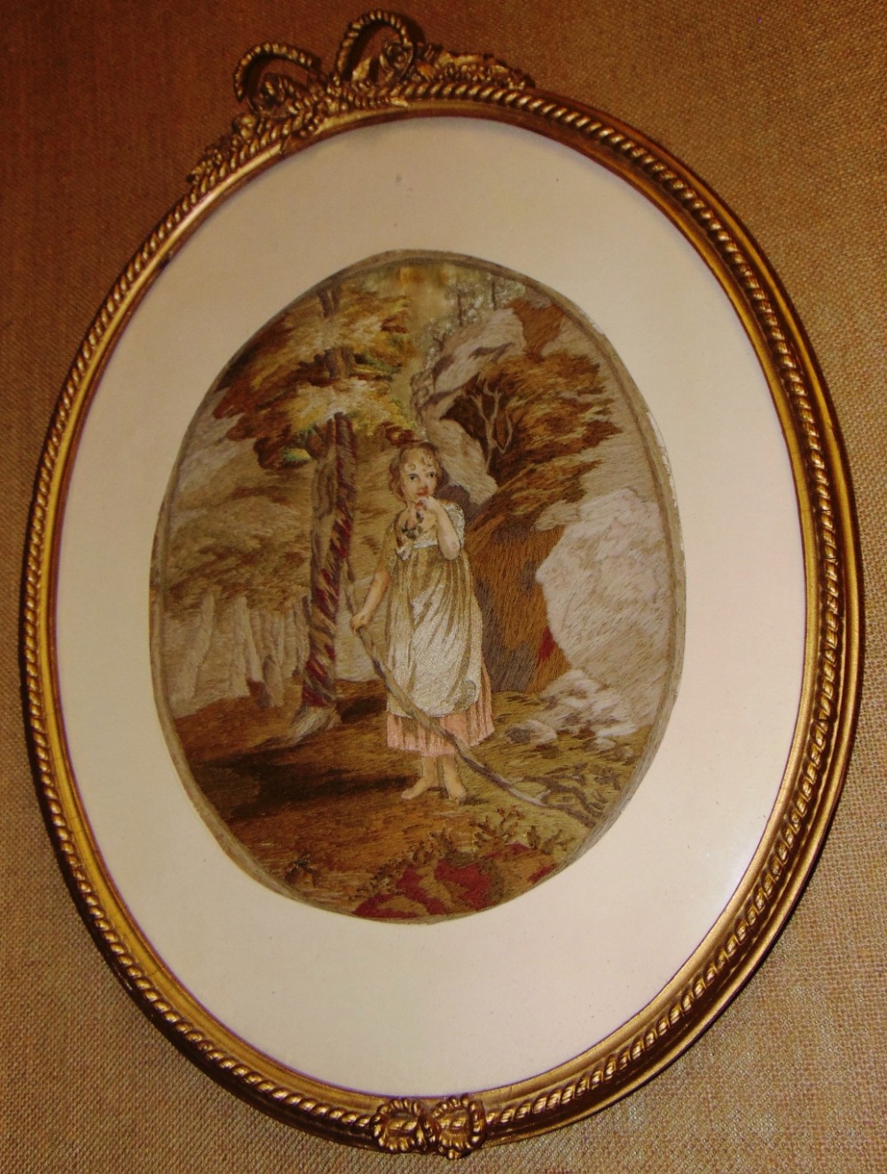 Georgian oval silkwork picture. Circa 1820